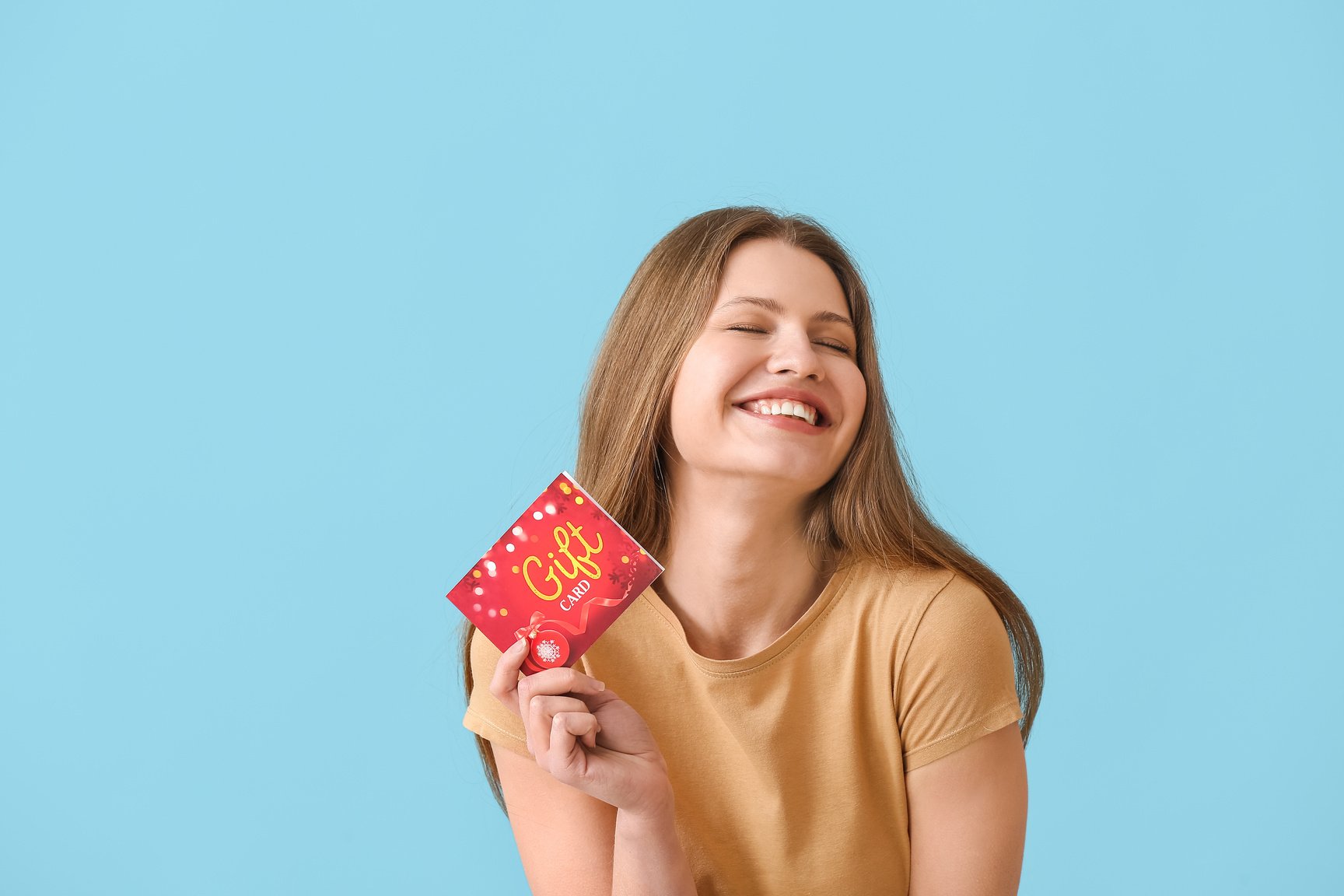 Happy Woman with Gift Card on Color Background